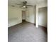 Neutral bedroom featuring a ceiling fan, walk in closet, and neutral carpet at 2200 San Vittorino Cir # 102, Kissimmee, FL 34741