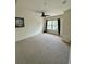 Bright bedroom featuring a ceiling fan and a large window at 2200 San Vittorino Cir # 102, Kissimmee, FL 34741