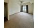 Bedroom featuring plush neutral carpet, and a window with curtains at 2200 San Vittorino Cir # 102, Kissimmee, FL 34741