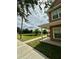 View of the community pond, visible from the home's covered porch at 2200 San Vittorino Cir # 102, Kissimmee, FL 34741