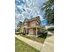 Charming townhome featuring a covered front porch and well-maintained landscaping at 2200 San Vittorino Cir # 102, Kissimmee, FL 34741