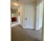 Hallway with door to the outside and bathroom visible in the background at 2200 San Vittorino Cir # 102, Kissimmee, FL 34741