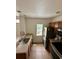 Functional kitchen with essential appliances, cabinets, and a sink at 2200 San Vittorino Cir # 102, Kissimmee, FL 34741