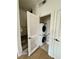 Convenient laundry closet with a stacked washer and dryer unit at 2200 San Vittorino Cir # 102, Kissimmee, FL 34741