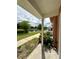 Relaxing porch view overlooking the pond, showcasing outdoor community amenities at 2200 San Vittorino Cir # 102, Kissimmee, FL 34741