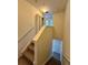 Carpeted stairway that provides access to the upper levels of the house at 2200 San Vittorino Cir # 102, Kissimmee, FL 34741