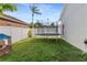 Large trampoline in the fenced backyard offering privacy and outdoor fun at 253 Clydesdale Cir, Sanford, FL 32773