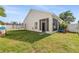 View of the backyard with a screen porch, showing ample space for outdoor activities at 253 Clydesdale Cir, Sanford, FL 32773