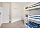 This bedroom features a bunkbed, closet, and interior door at 253 Clydesdale Cir, Sanford, FL 32773