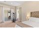 Bedroom featuring neutral carpet, sliding glass doors and a exercise machine at 253 Clydesdale Cir, Sanford, FL 32773