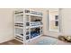 Bedroom features a triple bunk bed and natural light at 253 Clydesdale Cir, Sanford, FL 32773