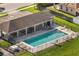 Aerial view of the community pool with a covered outdoor dining area at 253 Clydesdale Cir, Sanford, FL 32773