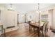 Open dining room with hardwood floors adjacent to the foyer and living room at 253 Clydesdale Cir, Sanford, FL 32773