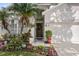 Charming home with a dark wood front door and colorful landscaping at 253 Clydesdale Cir, Sanford, FL 32773
