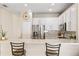Kitchen showcases a breakfast bar, stainless steel refrigerator, and ample cabinet space at 253 Clydesdale Cir, Sanford, FL 32773