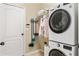 This laundry room has a stacked washer and dryer at 253 Clydesdale Cir, Sanford, FL 32773