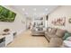 Spacious living room with a large sectional couch and an open view to the kitchen at 253 Clydesdale Cir, Sanford, FL 32773