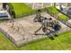 Aerial view of community playground with swings, slides, and climbing structures at 253 Clydesdale Cir, Sanford, FL 32773