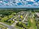 Aerial view of a residential neighborhood with well-maintained homes and lush green landscaping at 2781 Sand Oak Loop, Apopka, FL 32712