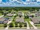 Sprawling community with mature trees, lush lawns, and beautiful single-Gathering homes on a sunny day at 2781 Sand Oak Loop, Apopka, FL 32712