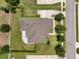 Aerial view of the house showcasing the backyard and surrounding trees at 2781 Sand Oak Loop, Apopka, FL 32712
