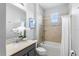 Bathroom featuring granite countertop and a shower/tub combination with white shower curtain at 2781 Sand Oak Loop, Apopka, FL 32712
