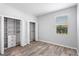 Bedroom with wood floors, closet with shelving, and a window at 2781 Sand Oak Loop, Apopka, FL 32712