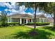 Charming front yard with manicured bushes and beautiful landscaping at 2781 Sand Oak Loop, Apopka, FL 32712