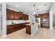 Modern kitchen featuring stainless steel appliances, island with granite countertop and breakfast bar at 2781 Sand Oak Loop, Apopka, FL 32712