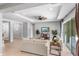 Cozy living room with modern decor, recessed lights, and sliding glass doors to the lanai at 2781 Sand Oak Loop, Apopka, FL 32712