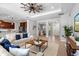 Open-concept living room with tile floors, recessed lights, open access to kitchen and dining at 2781 Sand Oak Loop, Apopka, FL 32712