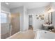 Main bathroom with a walk-in shower, soaking tub, and gray vanity at 2781 Sand Oak Loop, Apopka, FL 32712