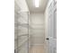 Walk-in pantry featuring wire shelving and tiled floors at 2781 Sand Oak Loop, Apopka, FL 32712