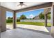 Covered outdoor patio with pavers and views of the backyard at 2781 Sand Oak Loop, Apopka, FL 32712