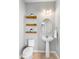 Powder room featuring floating wood shelves and pedestal sink at 2781 Sand Oak Loop, Apopka, FL 32712