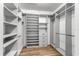Bright walk-in closet with custom shelving and drawers for optimal storage solutions at 2781 Sand Oak Loop, Apopka, FL 32712