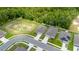 An aerial view of new homes in a vibrant community surrounded by lush green landscape at 3984 Mayhill Loop, Eustis, FL 32736
