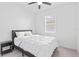 Bedroom with neutral decor, a comfortable bed and a window that provides ample natural light at 3984 Mayhill Loop, Eustis, FL 32736