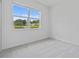 Bright bedroom with large window providing a nice view, carpet flooring and white walls at 3984 Mayhill Loop, Eustis, FL 32736