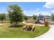 Community playground and picnic area with benches for Gathering fun at 3984 Mayhill Loop, Eustis, FL 32736