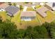 Aerial shot of the property reveals a spacious backyard and convenient location within a friendly neighborhood at 4064 Sunny Day Way, Kissimmee, FL 34744