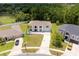 High-angle view displays this property's well-maintained landscaping, peaceful setting, and community features at 4064 Sunny Day Way, Kissimmee, FL 34744