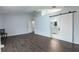 Bedroom showcasing hardwood flooring, neutral paint, and a sliding barn door that leads to the bathroom at 4064 Sunny Day Way, Kissimmee, FL 34744