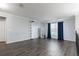 Upstairs living space with hardwood floors, natural light, and neutral wall color at 4064 Sunny Day Way, Kissimmee, FL 34744