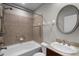 Bathroom featuring a shower-tub combination and vanity sink with a round mirror at 4244 Messina Dr, Lake Mary, FL 32746