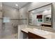 Spacious bathroom featuring a tiled glass shower and a sink with modern chrome fixtures at 4244 Messina Dr, Lake Mary, FL 32746