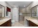 Well-lit bathroom with double vanity sinks, a large glass-enclosed shower, and a private toilet area at 4244 Messina Dr, Lake Mary, FL 32746