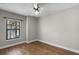 Bedroom with hardwood floors and a window that offers natural light at 4244 Messina Dr, Lake Mary, FL 32746