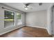 Bedroom featuring hardwood floors, a ceiling fan, and ample natural light at 4244 Messina Dr, Lake Mary, FL 32746