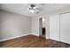 Bedroom featuring hardwood floors, closet, and a view of the bathroom at 4244 Messina Dr, Lake Mary, FL 32746